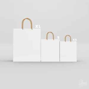 Three plain white paper gift bags in XL, S, and XS sizes featuring twisted gold rope handles on a clean grey background.