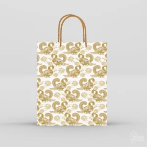 White gift paper bag with golden peacock pattern and braided gold rope handles against a light grey background.