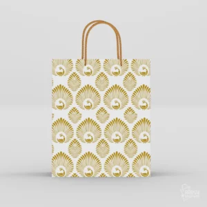 White and gold peacock return gift bag with intricate plume motifs and braided golden rope handles